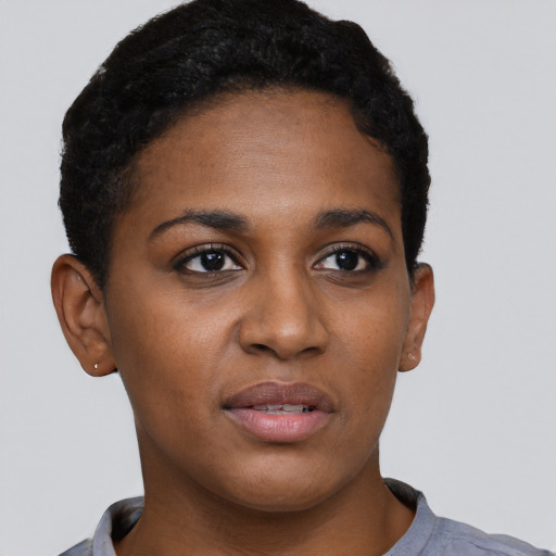 Joyful black young-adult female with short  brown hair and brown eyes