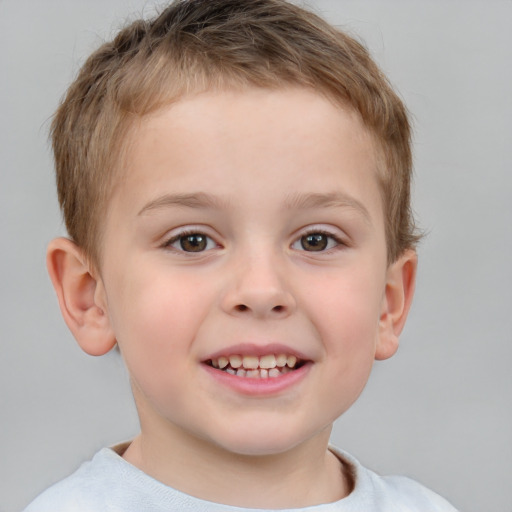 Joyful white child male with short  brown hair and brown eyes