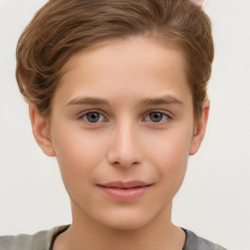 Joyful white child female with short  brown hair and brown eyes