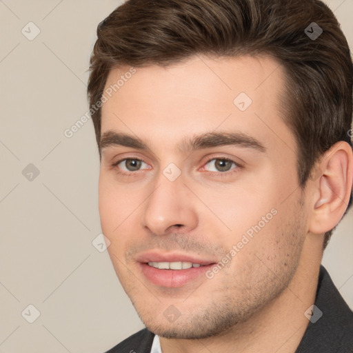 Joyful white young-adult male with short  brown hair and brown eyes