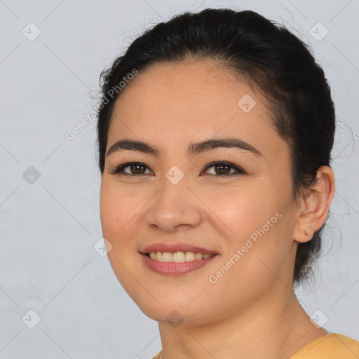 Joyful asian young-adult female with short  brown hair and brown eyes