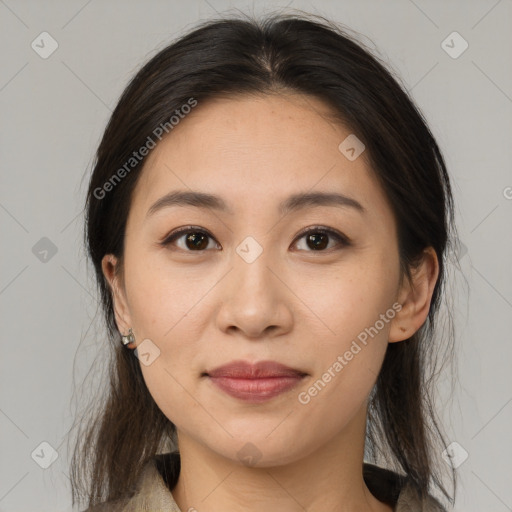 Joyful asian young-adult female with medium  brown hair and brown eyes