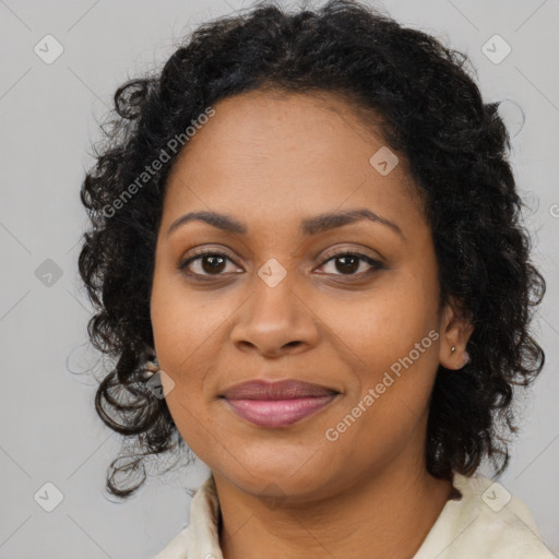 Joyful black young-adult female with long  brown hair and brown eyes