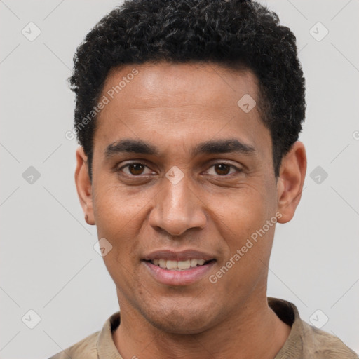 Joyful black young-adult male with short  black hair and brown eyes