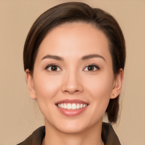 Joyful white young-adult female with medium  brown hair and brown eyes