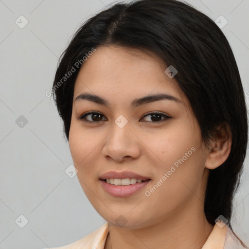 Joyful asian young-adult female with medium  black hair and brown eyes