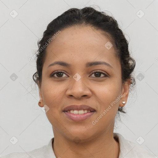 Joyful latino young-adult female with short  brown hair and brown eyes