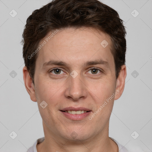 Joyful white adult male with short  brown hair and grey eyes