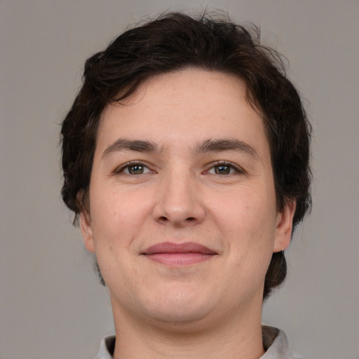 Joyful white young-adult male with medium  brown hair and brown eyes