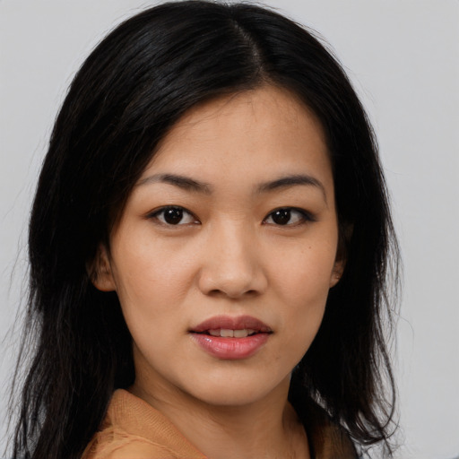 Joyful white young-adult female with long  black hair and brown eyes