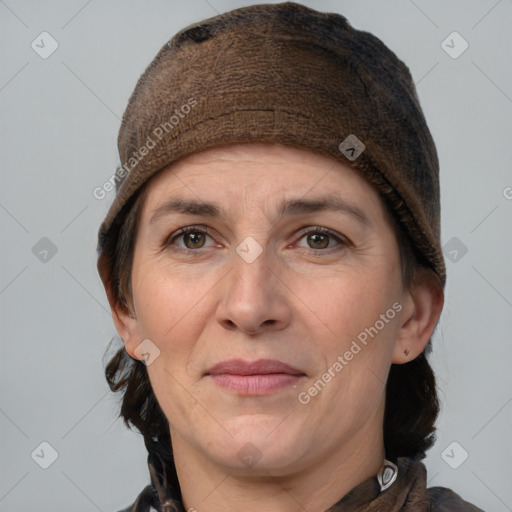 Joyful white adult female with medium  brown hair and grey eyes