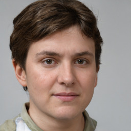 Joyful white young-adult female with short  brown hair and grey eyes