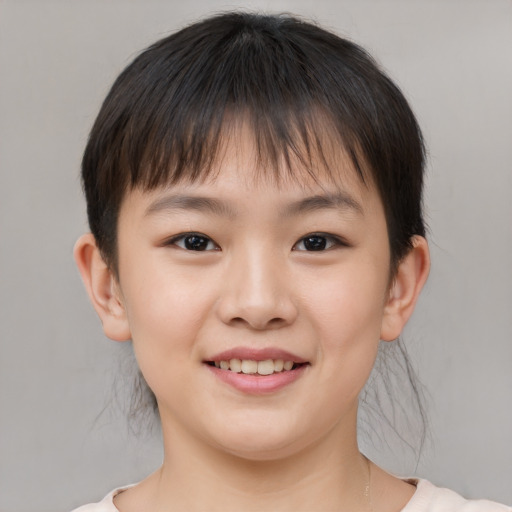 Joyful white child female with short  brown hair and brown eyes