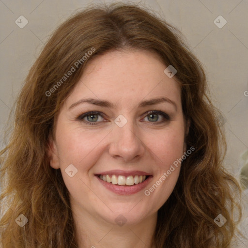 Joyful white young-adult female with long  brown hair and green eyes