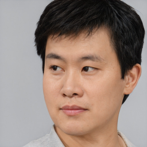 Neutral asian young-adult male with short  black hair and brown eyes