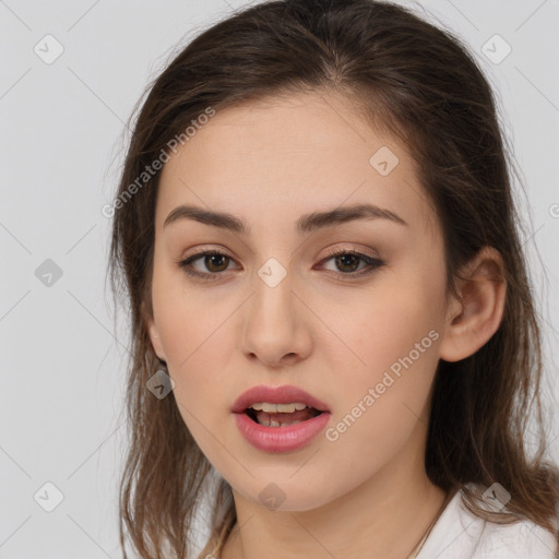 Neutral white young-adult female with long  brown hair and brown eyes