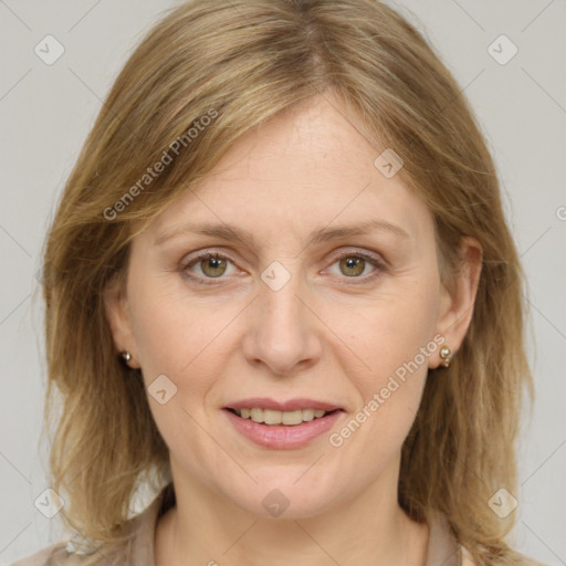 Joyful white adult female with medium  brown hair and grey eyes