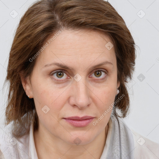 Joyful white adult female with medium  brown hair and blue eyes