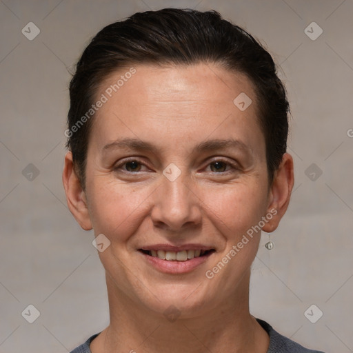 Joyful white adult female with short  brown hair and brown eyes