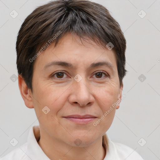 Joyful white adult female with short  brown hair and brown eyes