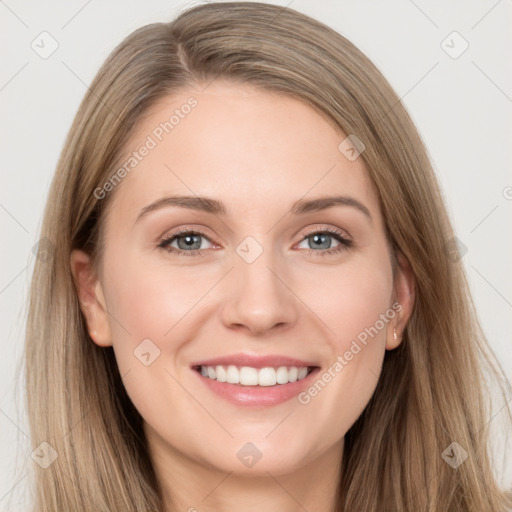 Joyful white young-adult female with long  brown hair and grey eyes