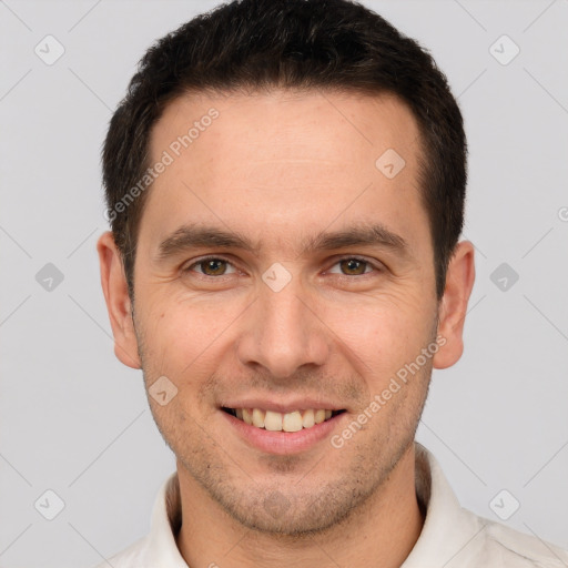 Joyful white young-adult male with short  brown hair and brown eyes