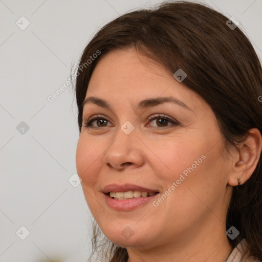 Joyful white adult female with medium  brown hair and brown eyes