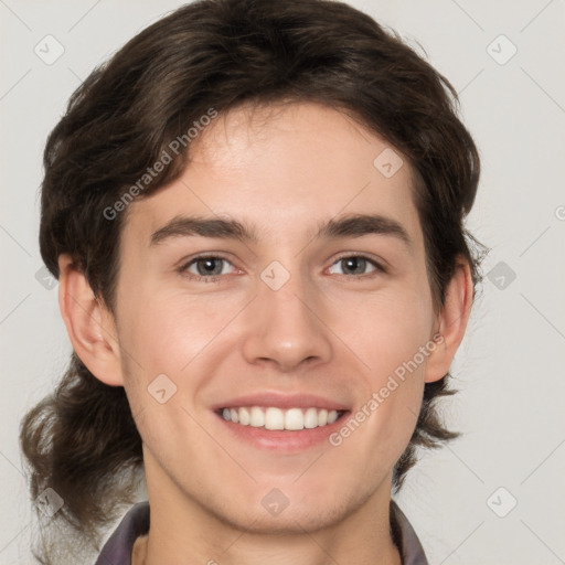 Joyful white young-adult male with medium  brown hair and brown eyes