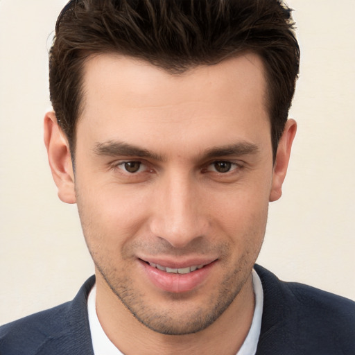 Joyful white young-adult male with short  brown hair and brown eyes