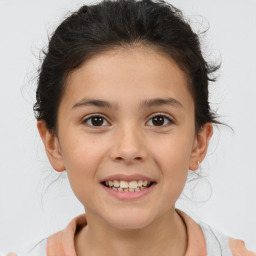 Joyful white child female with short  brown hair and brown eyes