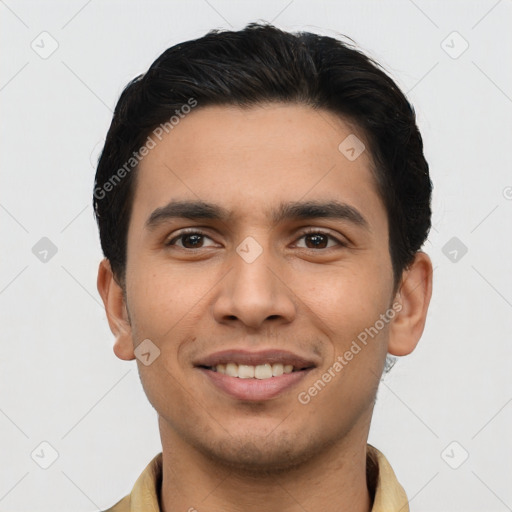 Joyful latino young-adult male with short  black hair and brown eyes