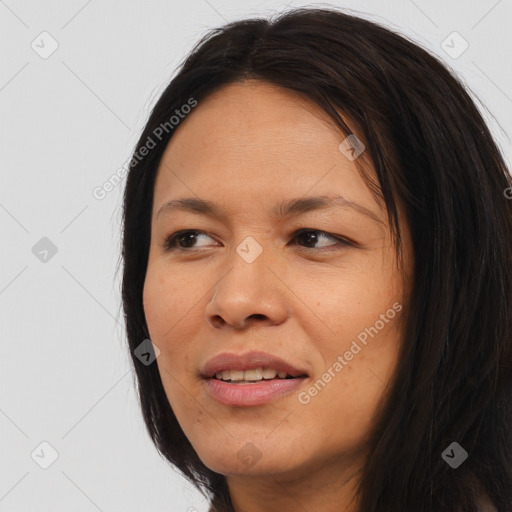 Joyful asian young-adult female with long  black hair and brown eyes