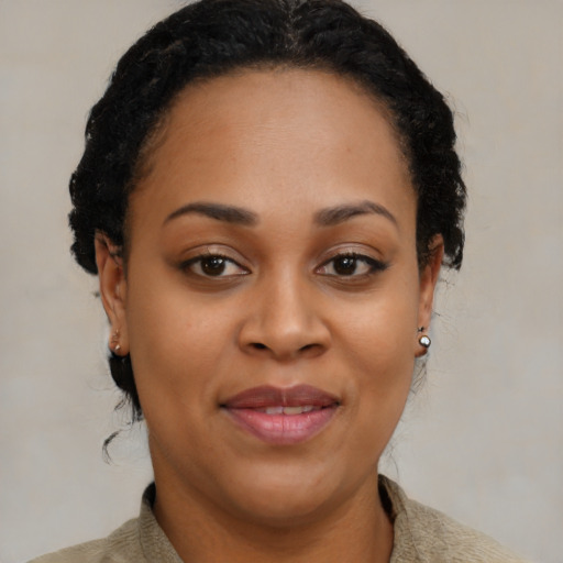 Joyful black young-adult female with medium  brown hair and brown eyes