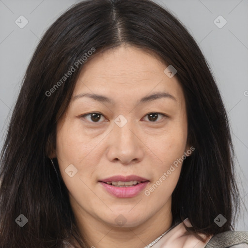 Joyful white adult female with medium  brown hair and brown eyes