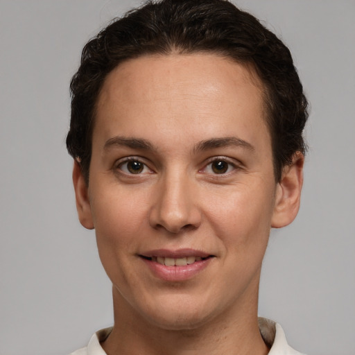 Joyful white young-adult female with short  brown hair and brown eyes