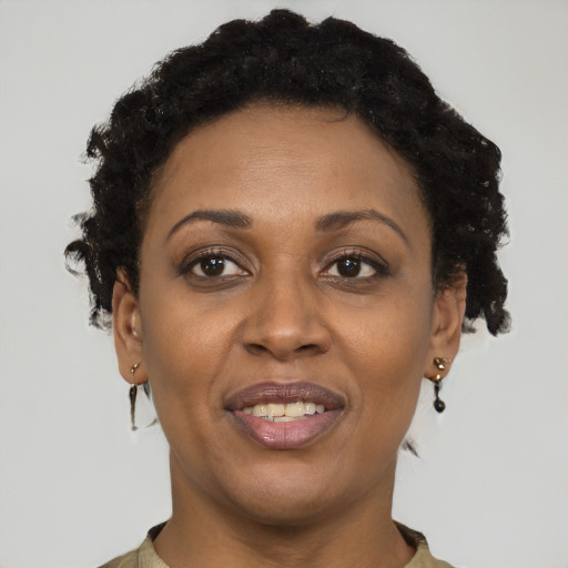 Joyful latino adult female with short  brown hair and brown eyes