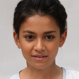 Joyful white child female with short  brown hair and brown eyes