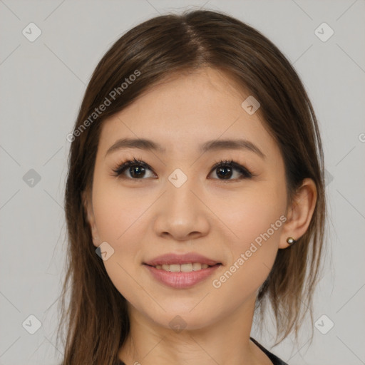 Joyful asian young-adult female with long  brown hair and brown eyes