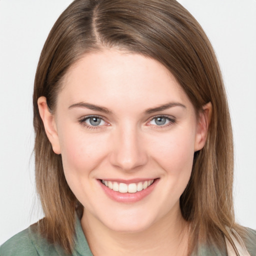 Joyful white young-adult female with long  brown hair and blue eyes