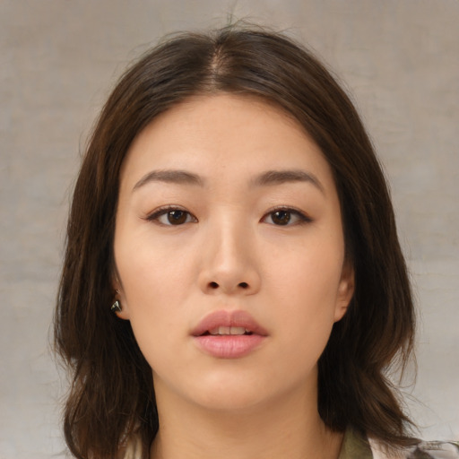 Neutral asian young-adult female with medium  brown hair and brown eyes