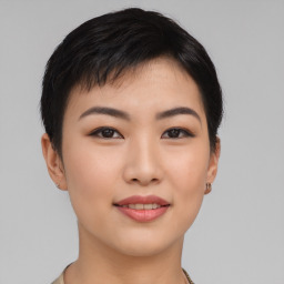 Joyful asian young-adult female with short  black hair and brown eyes