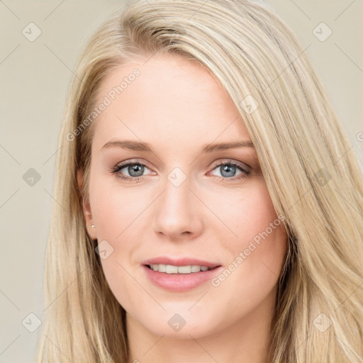 Joyful white young-adult female with long  brown hair and blue eyes