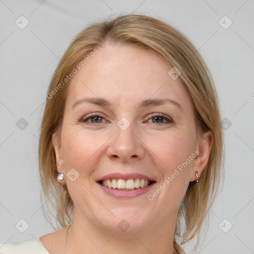 Joyful white adult female with medium  brown hair and blue eyes