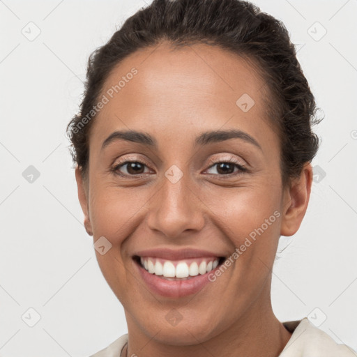 Joyful white young-adult female with short  brown hair and brown eyes