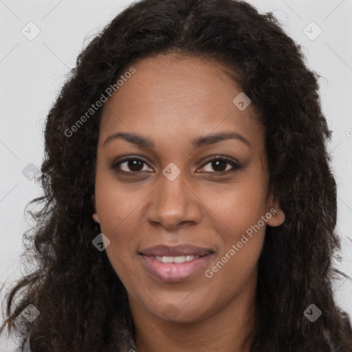 Joyful black young-adult female with long  brown hair and brown eyes