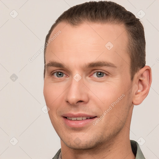 Joyful white young-adult male with short  brown hair and brown eyes