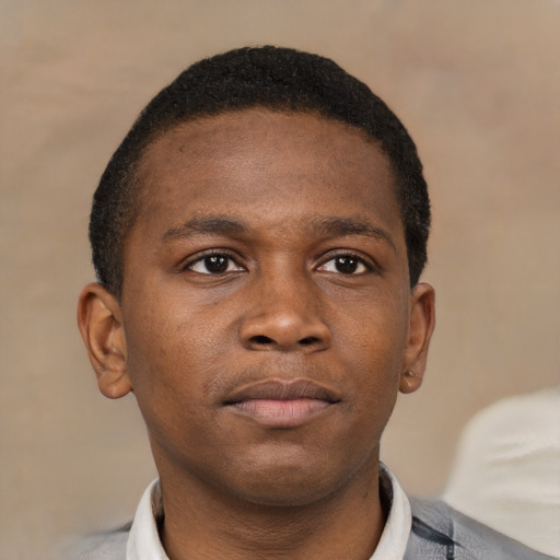 Neutral black young-adult male with short  brown hair and brown eyes