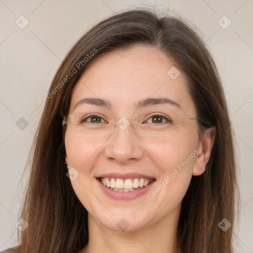 Joyful white adult female with long  brown hair and brown eyes