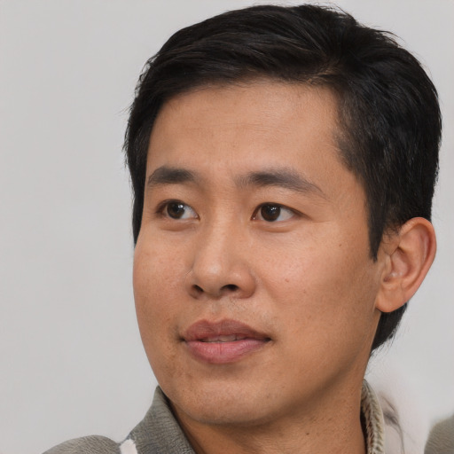 Neutral asian young-adult male with short  black hair and brown eyes
