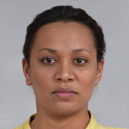 Neutral latino adult female with short  brown hair and brown eyes